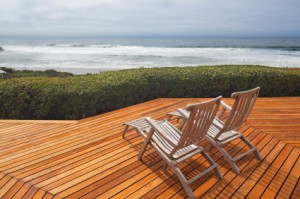 Wooden verandah with view and beach chairs